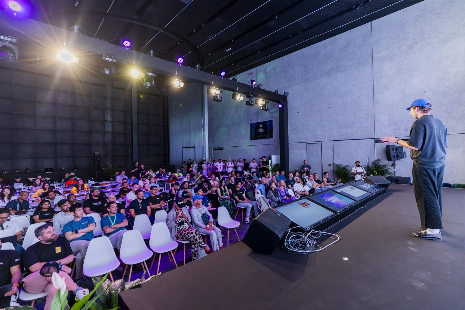 Speaker addressing developers at a hacker house in Dubai